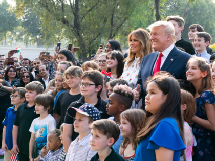 President Donald J. Trump and First Lady Melania Trump pose for a photo with the children