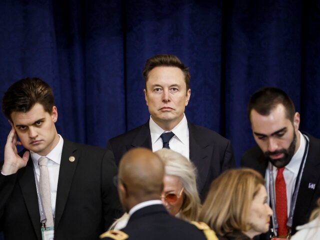 Elon Musk with a stern look on his face Elon Musk with a stern look on his faceElon Musk with a stern look on his face