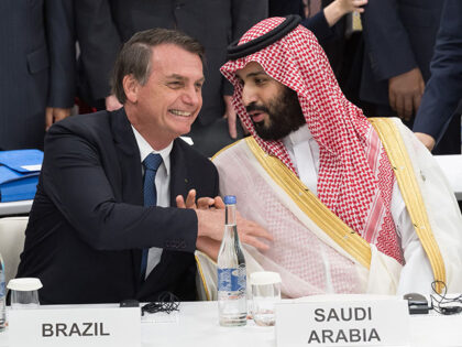 Brazil's President Jair Bolsonaro (L) shakes hands with Saudi Arabia's Crown Prince Mohamm