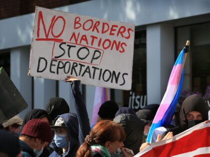 LONDON, ENGLAND - SEPTEMBER 24: A counter demonstration forms near the Home Office with a