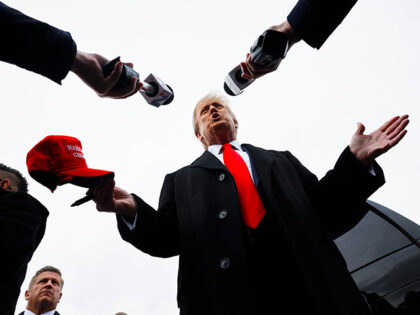 Republican presidential candidate, former U.S. President Donald Trump talks to reporters w