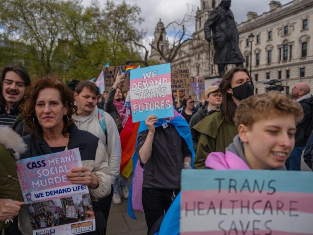 LONDON, ENGLAND - APRIL 20: Trans rights activists take part in a protest against the ban