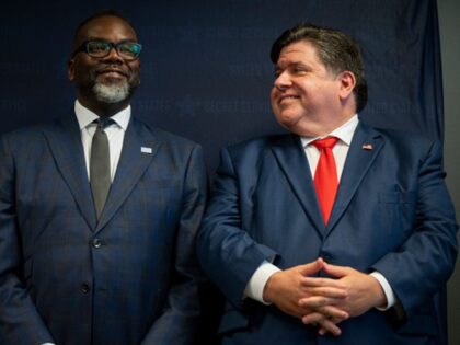 CHICAGO, ILLINOIS - JULY 25: Illinois Governor JB Pritzker (R) smiles at Chicago Mayor Bra