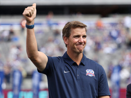 Former New York Giants player Eli Manning acknowledges the crowd during a half time ceremo