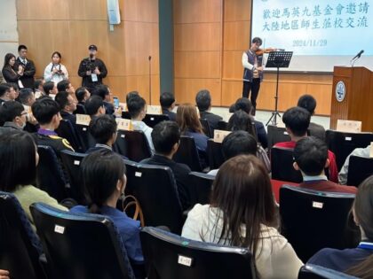 TAIPEI, CHINA - NOVEMBER 29: A member of delegation consisting of 40 students and teachers