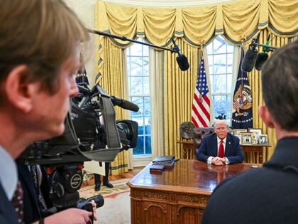 US President Donald Trump speaks to the press before signing an executive order in the Ova