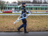 OREBRO, SWEDEN - FEBRUARY 5: Police officers cordon off the crime scene with barricade tap