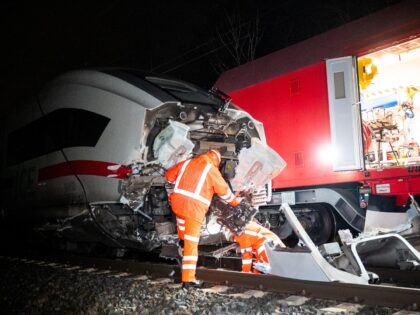 12 February 2025, Hamburg: Railroad technicians work on a damaged ICE after a train accide