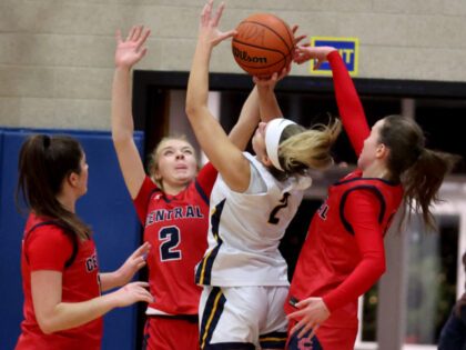 Hingham, MA - January 13 - Central Catholic #2 Kate Galvin and #4 Caroline Vient try to st