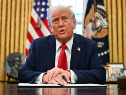 US President Donald Trump speaks to the press as he signs an executive order to create a U