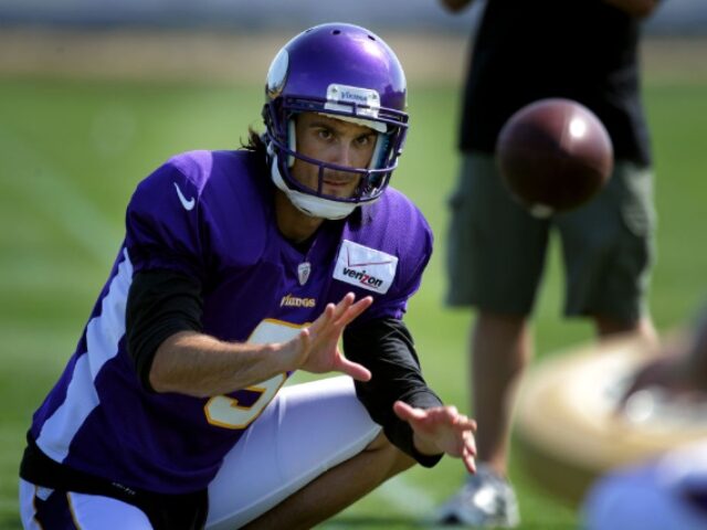 Vikings punter Chris Kluwe practice holding the ball for a field goal attempt durning the