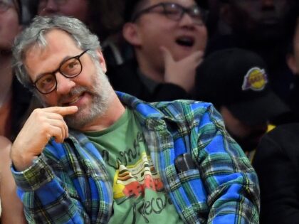 LOS ANGELES, CA - JANUARY 04: Iris Apatow and Judd Apatow attend a basketball game between