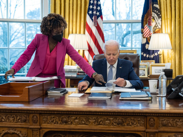 Karine Jean-Pierre with President Biden President Joe Biden confers with Press Secretary Karine Jean-Pierre during a daily press m