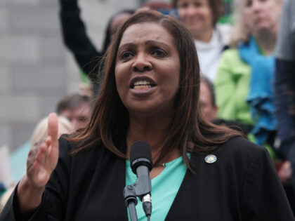 New York Attorney General Letitia James speaks to hundreds of people as they gather in Fol