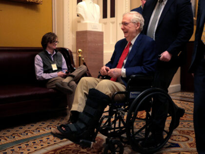 Sen. Mitch McConnell (R-KY) is pushed in a wheelchair at the U.S. Capitol on February 20,