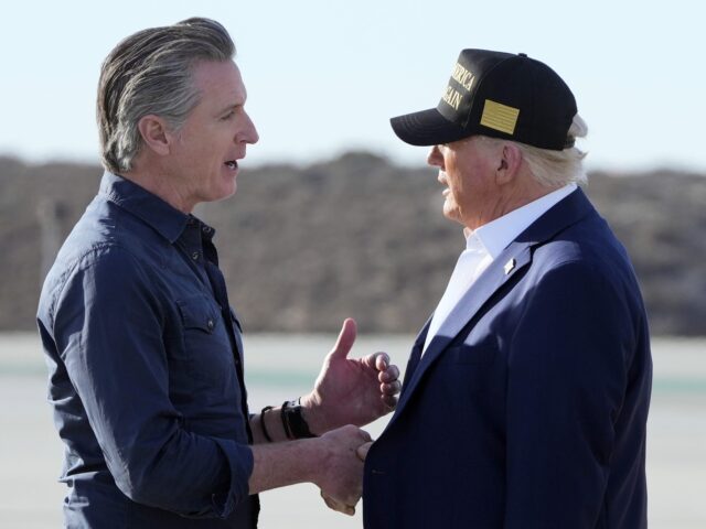 President Donald Trump talks with California Gov. Gavin Newsom after arriving on Air Force