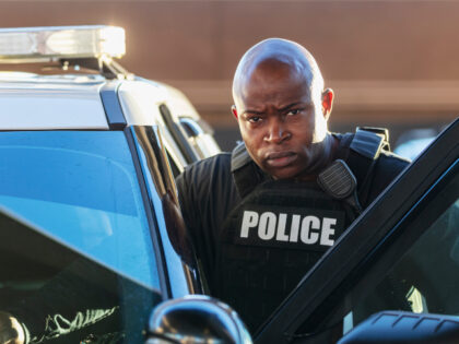 Policeman getting out of his cruiser