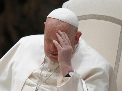 Pope Francis touches his forehead during his weekly general audience in the Paul VI Hall,