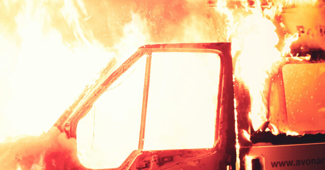 WATCH: Cop, Firefighter Rescue Woman from Burning Pickup After Crash