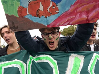 ROME, ITALY - 2023/03/03: A protester holds up a placard and shouts slogans during the dem