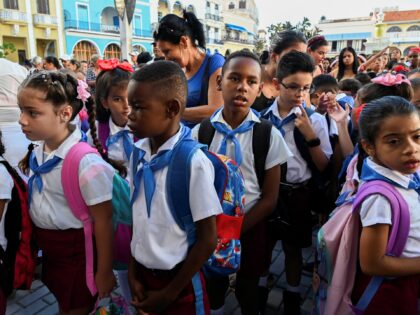 Students gather before getting into their classrooms on their first day of school in Havan