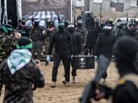 Hamas Terrorists Return Murdered Israeli Hostages in Black Coffins