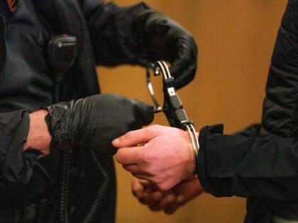 15 January 2024, Lower Saxony, Osnabrück: A court officer removes the defendant's handcuf