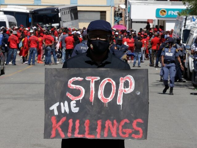 A white protester against farm murders stands near the magistrates court in Senekal, South