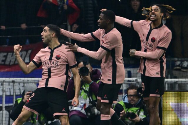 Achraf Hakimi (L) celebrates after scoring one of his two goals in Paris Saint-Germain's 3