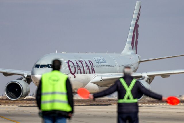 An Australian couple have criticised Qatar Airways after a blanket-draped corpse was seate