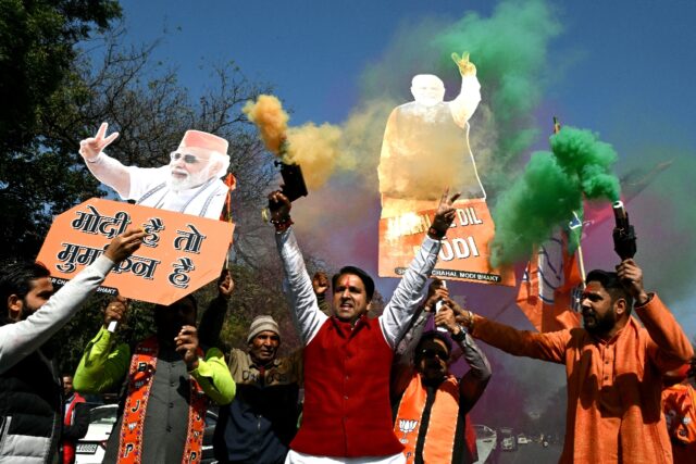 BJP supporters celebrating outside their party headquarters in New Delhi