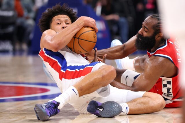 Cade Cunningham of the Detroit Pistons dives on the floor for a loose ball against James H