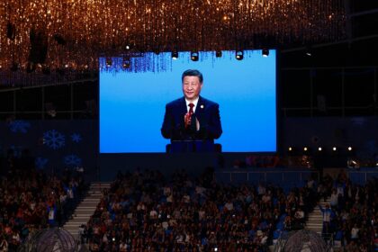 China's President Xi Jinping is pictured on a screen during the opening ceremony of the 20