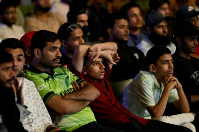 Death of a dream: Cricket fans in Karachi watch a live broadcast of the Champions Trophy m