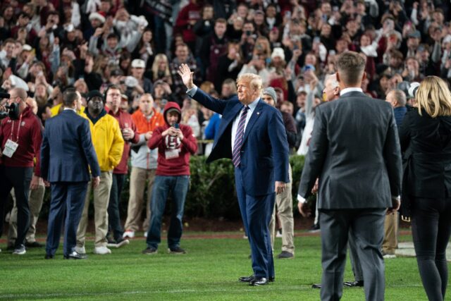 Donald Trump attends a US college football game in 2023; on Sunday he will become the firs