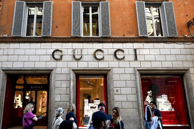 Despite a drop in earnings, shares in Gucci's parent company jumped as the results were no