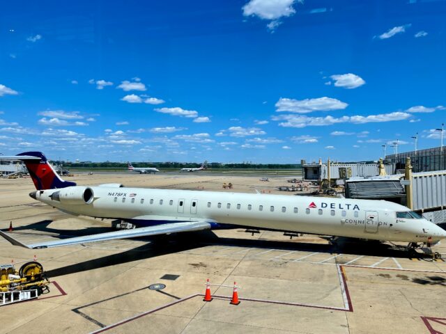 This file photograph shows a Delta Bombardier CRJ-900 at the gate at Ronald Reagan Washing
