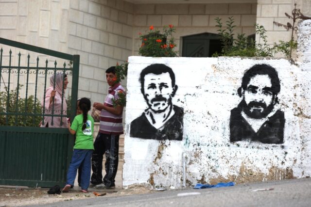 Graffiti of Nael Barghouti (L) and another long-serving Israeli prisoner Fakhri Barghouti,