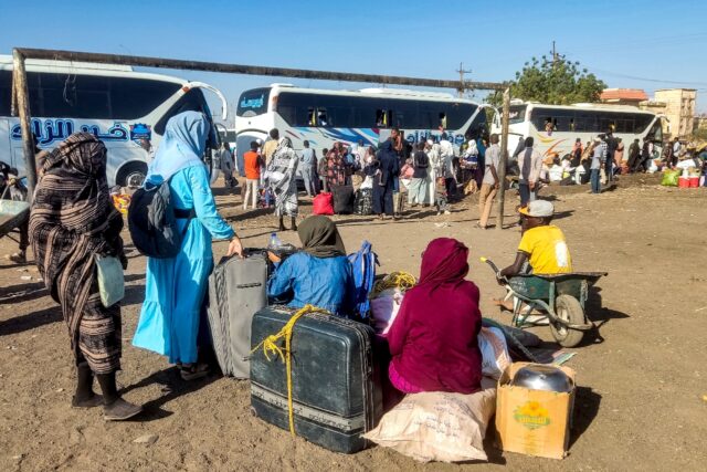 People displaced by the war in Sudan prepare to board buses home to Wad Madani in Jazira s