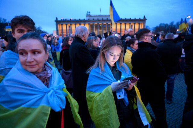 People gather in central Berlin for a protest in support of Ukraine on the third anniversa