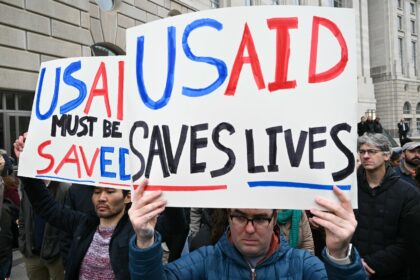 People protest outside of the headquarters for United States Agency for International Deve