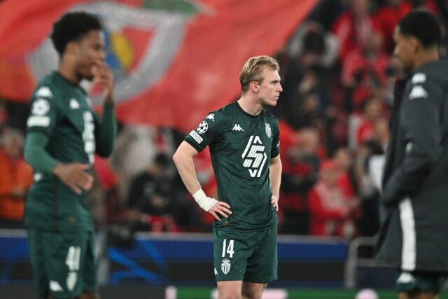 New signing Mika Biereth (c) and his Monaco teammates look on after being knocked out of t