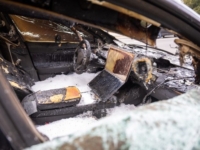 A burned out Tesla targeted by arsonists