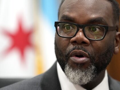 Chicago Mayor Brandon Johnson responds to a question in his City Hall office during an int