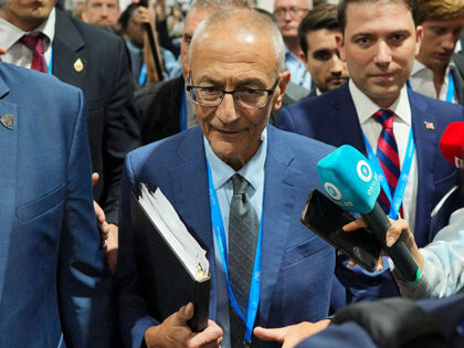 John Podesta, U.S. climate envoy, walks through a crowd during the COP29 U.N. Climate Summ