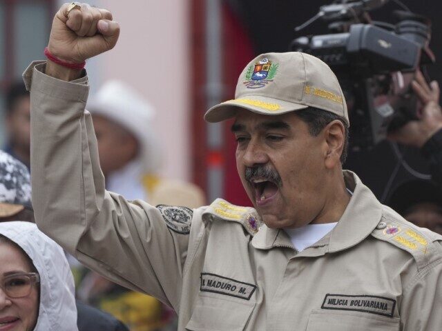 President Nicolas Maduro gestures to supporters during an event marking the 165th annivers