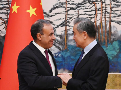 Egyptian Foreign Minister Badr Abdelatty, left, and Chinese Foreign Minister Wang Yi shake