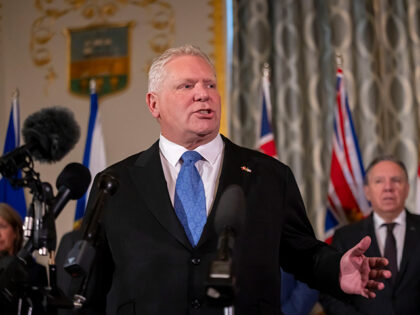 Premier of Ontario Doug Ford speaks to reporters, accompanied by other Council of the Fede