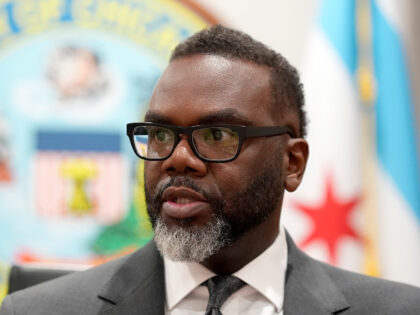 Chicago Mayor Brandon Johnson responds to a question in his City Hall office during an int