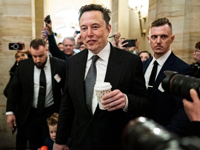 Elon Musk greets reporters